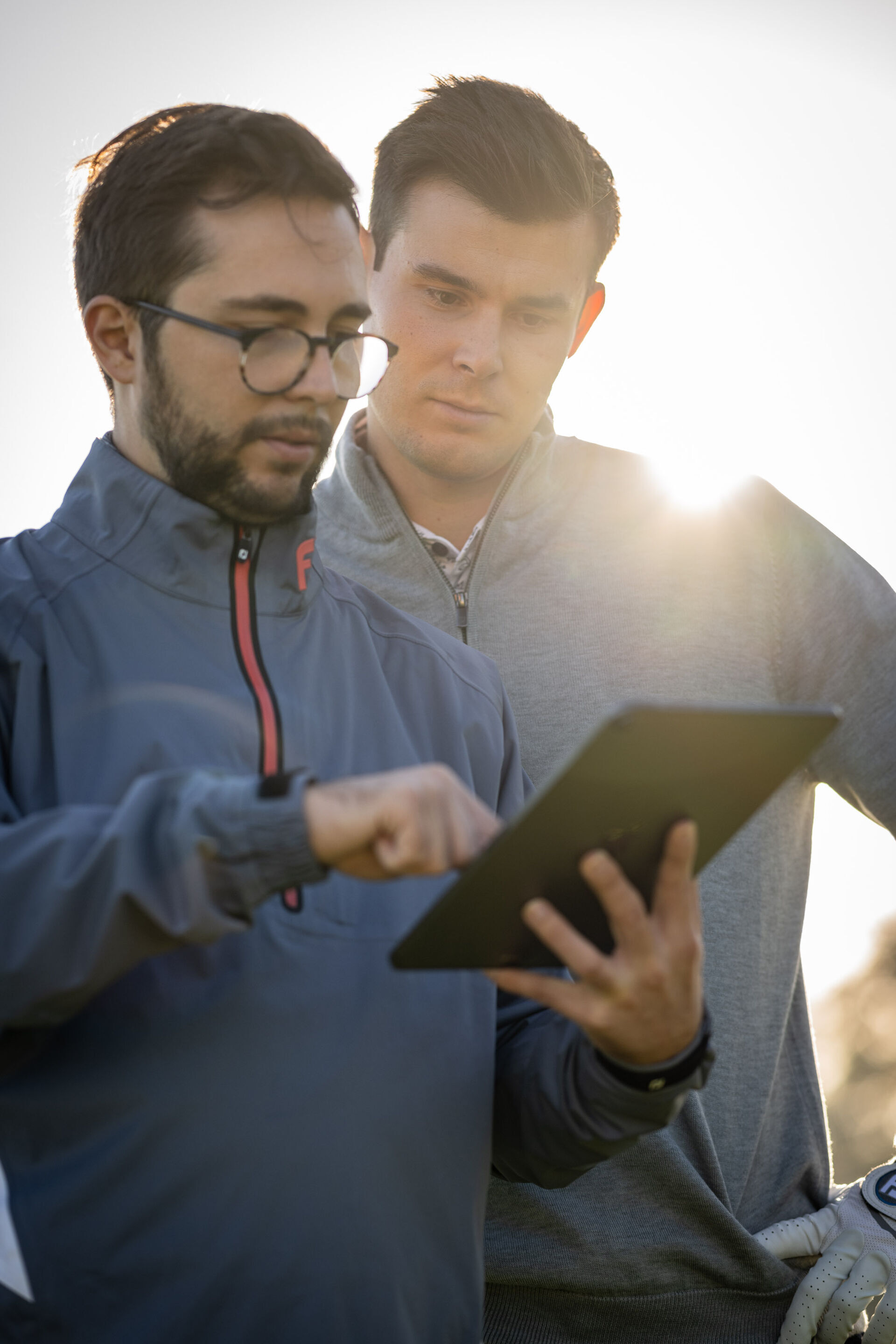 player-and-coach-looking-at-data